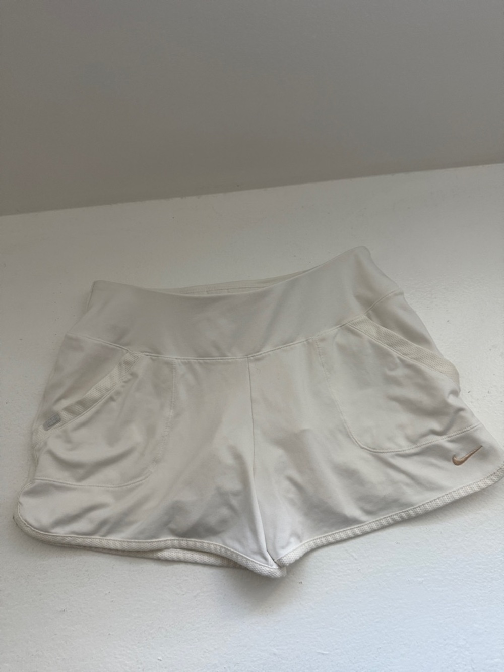 Nike Women’s Cream Athletic Shorts with Gold Swoosh